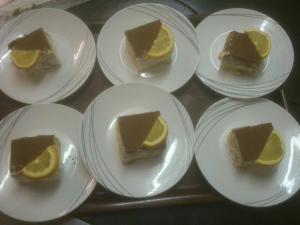 a group of slices of cake on plates on a table at Pension Alpenstern in Oberau