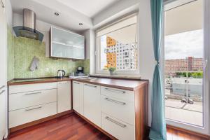 Kuchyňa alebo kuchynka v ubytovaní Apartamenty Sun&Snow Marina Primore