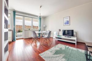 Televízia a/alebo spoločenská miestnosť v ubytovaní Apartamenty Sun&Snow Marina Primore