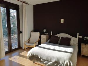 Postel nebo postele na pokoji v ubytování Hostal San Martin