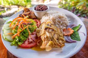 a plate of food on a table at Hotel Banana Azul - Adults Only in Puerto Viejo