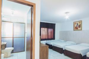 Postel nebo postele na pokoji v ubytování Hotel Holiday Foz