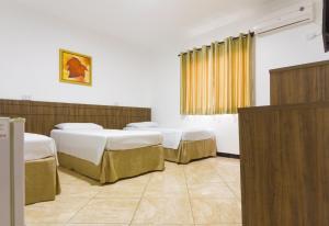Postel nebo postele na pokoji v ubytování Hotel Holiday Foz