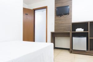 TV a/nebo společenská místnost v ubytování Hotel Holiday Foz