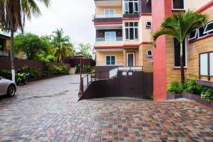 a brick driveway with a gate in front of a building at Hamptons at Fairway across from AC Marriott Unit No3 in Kingston