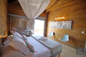 En eller flere senge i et værelse på Résidence Eden Océan avec vue mer + 35 billeder