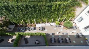 an overhead view of a patio with tables and chairs at Hotel Milano Castello in Milan