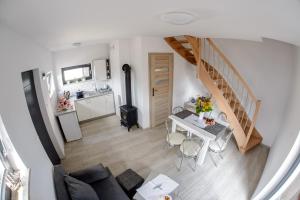 an overhead view of a living room and kitchen with a table at Amber Playa in Dębki
