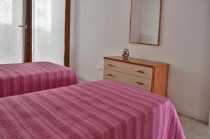Postel nebo postele na pokoji v ubytování Casa Comisso