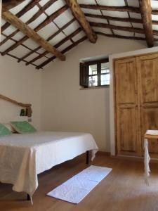 Postel nebo postele na pokoji v ubytování Agriturismo Sa Mendhula