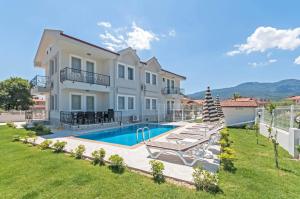 an image of a villa with a swimming pool at Dalyan Twins Minta Villa in Dalyan