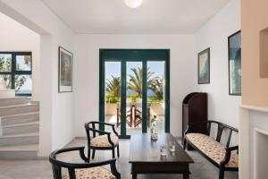 a dining room with a table and chairs at Aris Villa in Panormos Rethymno