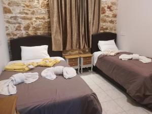 Posteľ alebo postele v izbe v ubytovaní Skourtaniotis spa rooms + 16 fotografií