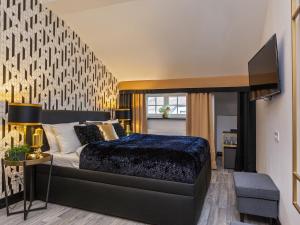 Postel nebo postele na pokoji v ubytování Golden Prague Rooms
