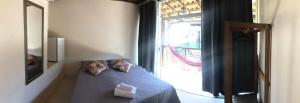 Cama ou camas em um quarto em Pousada Porto do Sol