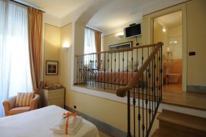Postel nebo postele na pokoji v ubytování A Palazzo Busdraghi Residenza D'Epoca