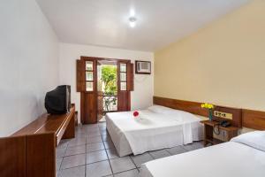 Postel nebo postele na pokoji v ubytování Chauã Porto Hotel + 22 fotografií