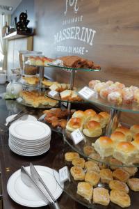 a bakery with a display of pastries and other desserts at Sol Ipanema Hotel in Rio de Janeiro