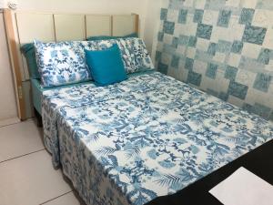 Кровать или кровати в номере Condomínio com Apartamentos a Beira Mar