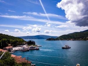 a group of boats in a large body of water at Apartments Eftimov in Tivat