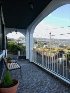 a porch with a bench and a view at Atlantic house in Gaula