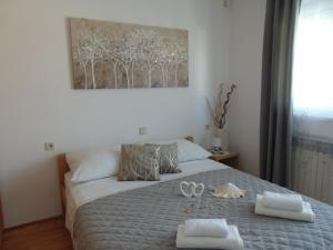 Postel nebo postele na pokoji v ubytování Apartments Marija