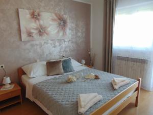 Postel nebo postele na pokoji v ubytování Apartments Marija