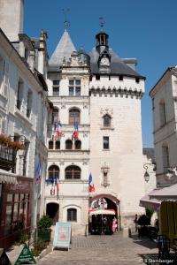 a building with a clock tower on top of it at La Demeure Saint-Ours in Loches