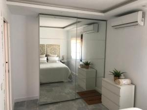 A bed or beds in a room at Luxury Loft Malaga Torremolinos Sol