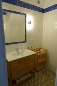 a bathroom with a sink and a mirror at Casa La Abuela in Chulilla