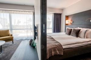 Postel nebo postele na pokoji v ubytování Hotel Riviera Strand + 33 fotografií
