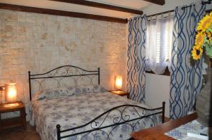 Ένα ή περισσότερα κρεβάτια σε δωμάτιο στο Agriturismo Pagliuzzo
