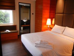 Postel nebo postele na pokoji v ubytování C'haya Hotel