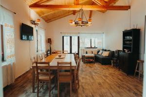a living room with a table and a couch at Pensiunea Aer de Munte in Recea