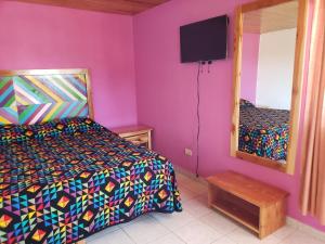 Postel nebo postele na pokoji v ubytování Villas La Quinta