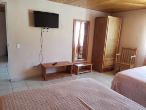 Postel nebo postele na pokoji v ubytování Villas La Quinta