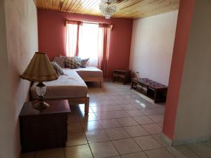 Postel nebo postele na pokoji v ubytování Villas La Quinta