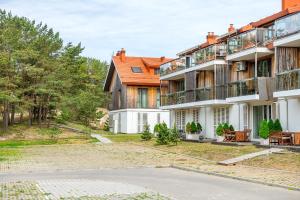 an exterior view of a building at Kopu Vetrunges - Nida Apartments in Nida