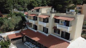 an aerial view of a house with red tile roofs at Vasilaras Hotel in Skala