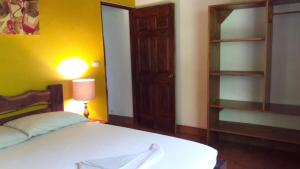 Cama o camas de una habitación en OceanBlue Samara Lodge