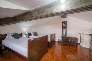 Ένα ή περισσότερα κρεβάτια σε δωμάτιο στο Casa das Arcadas