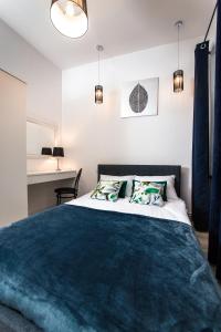 Ένα ή περισσότερα κρεβάτια σε δωμάτιο στο Moonlight Apartament