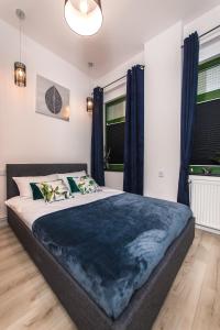 Ένα ή περισσότερα κρεβάτια σε δωμάτιο στο Moonlight Apartament +15 φωτογραφίες