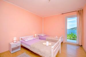 Postel nebo postele na pokoji v ubytování Apartment Barisa