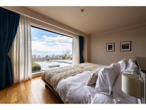 Letto o letti in una camera di the salon 伊豆高原 Hotels & Resort
