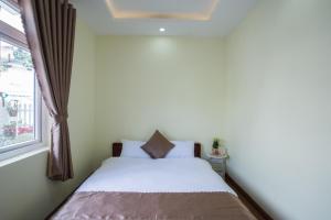 Voodi või voodid majutusasutuse LuTo Hotel toas