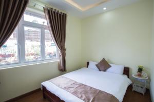 Voodi või voodid majutusasutuse LuTo Hotel toas