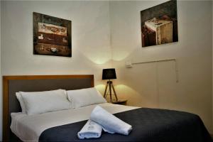 Postel nebo postele na pokoji v ubytování Delatite Hotel