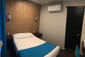 Postel nebo postele na pokoji v ubytování Hotel Raga Inn