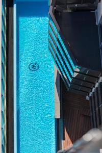 a blue water fountain sitting in the middle of a building at Imagine Marco in Melbourne